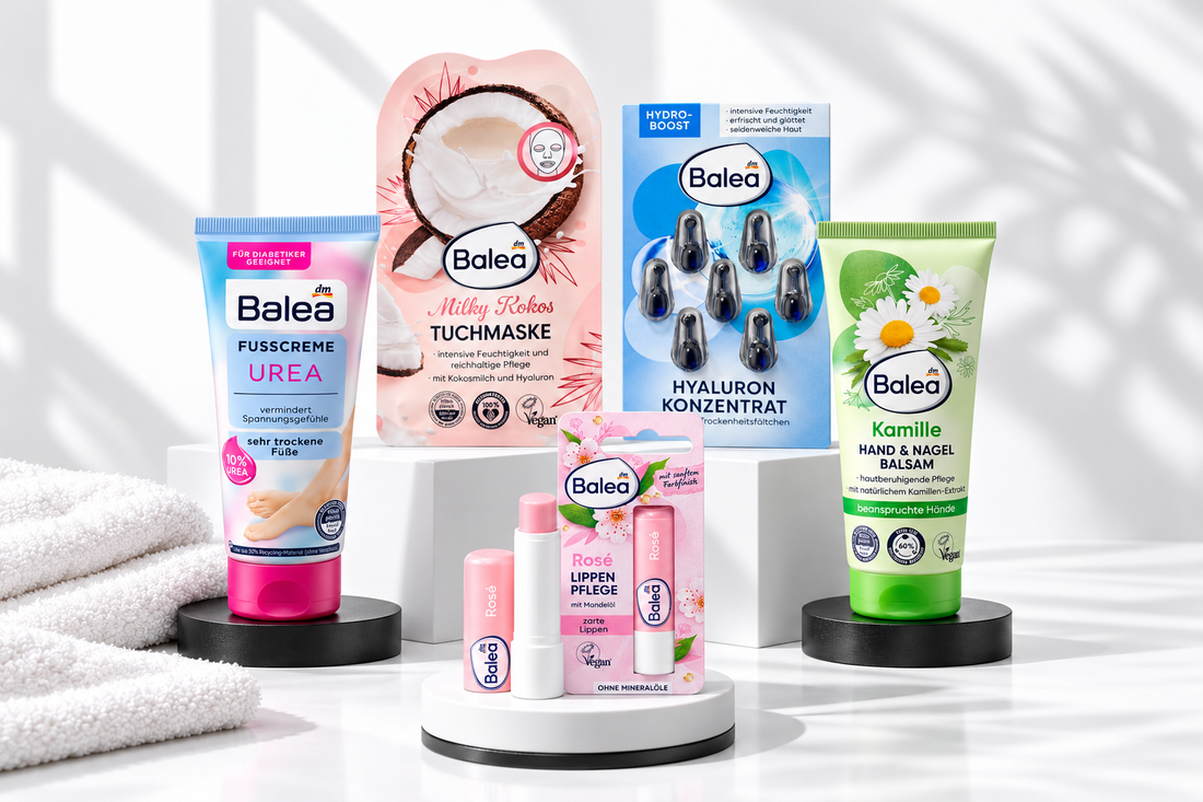 Balea lip balm, coconut sheet mask, hyaluronic acid capsules, hand balm and urea foot cream on a black and white display